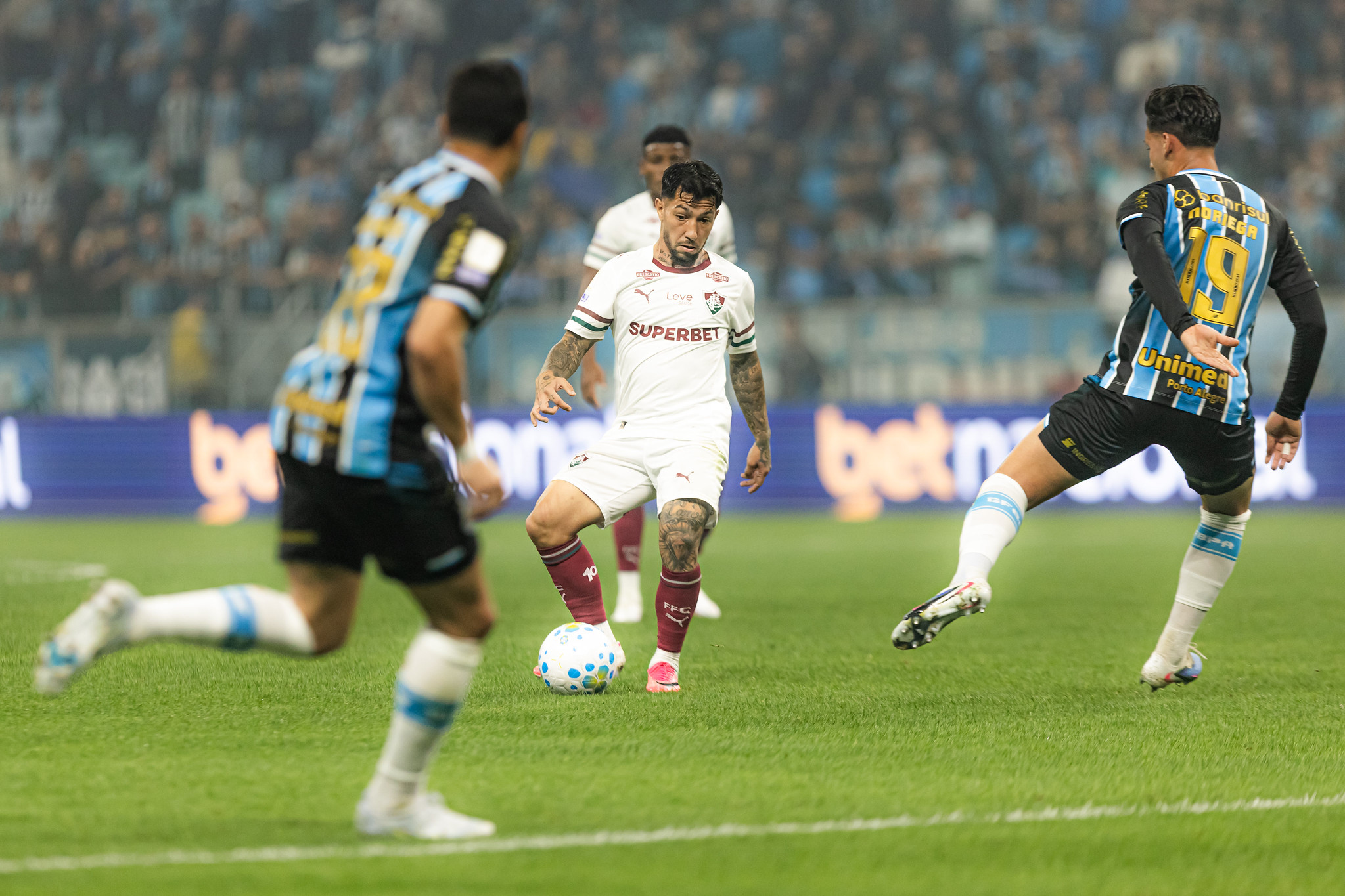 26/07/2026 — 18h30 (Brasília UTC-3): Fluminense empata com o Grêmio por 1 a 1 na Arena do Grêmio; transmissão YouTube | Canal da Gazeta Esportiva (YouTube)